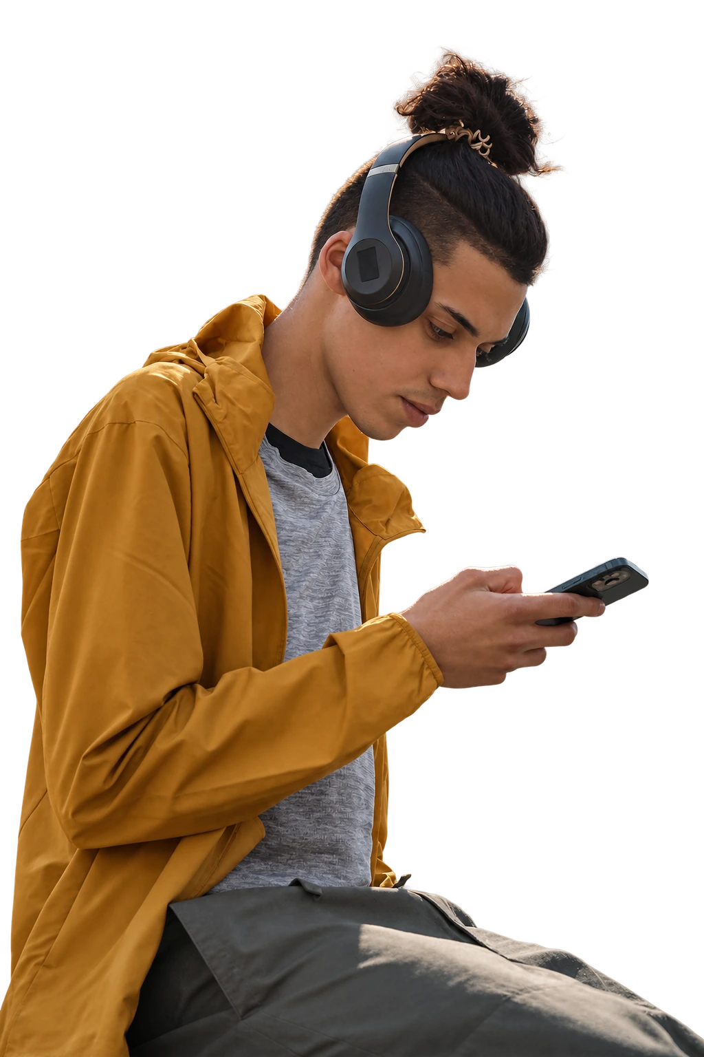 A man with headphones looks at his phone